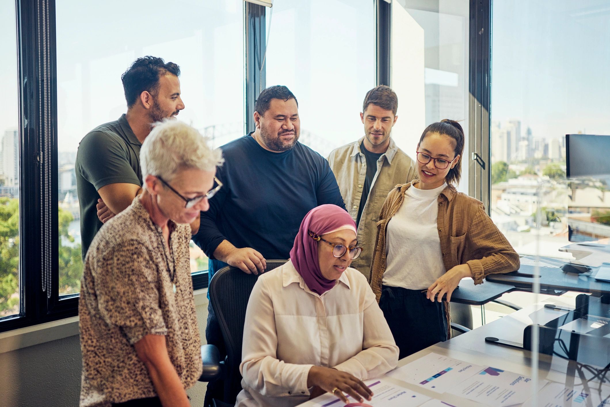 Software team collaborating in an office meeting